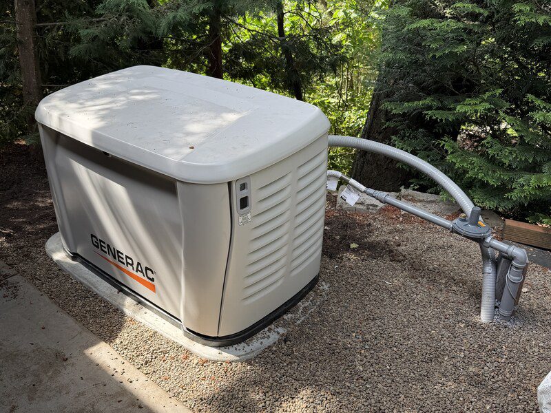Generac home standby generator installed on a pad by Electric Avenue