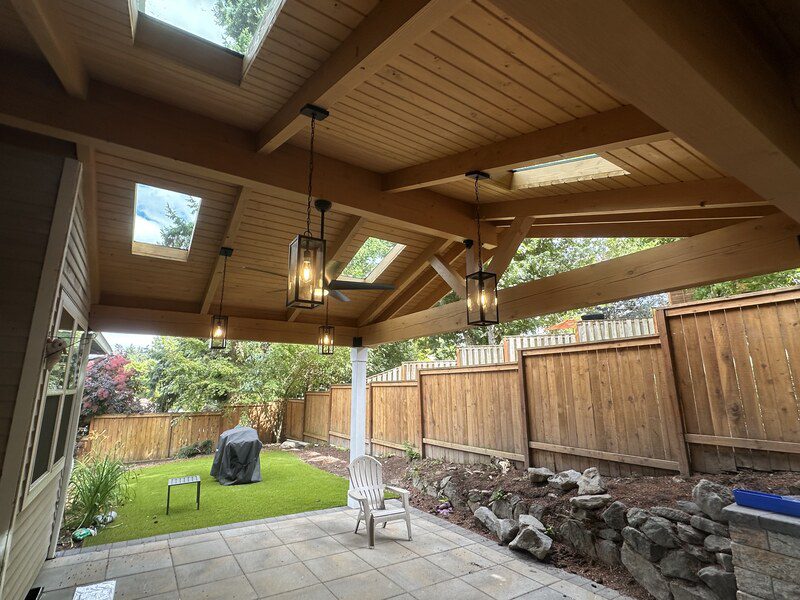 Covered patio with pendant lantern lighting installed by Electric Avenue in Portland